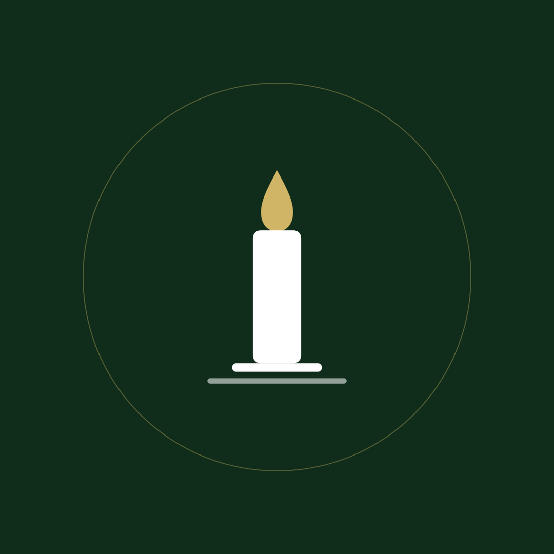 A lit candle with a gold flame