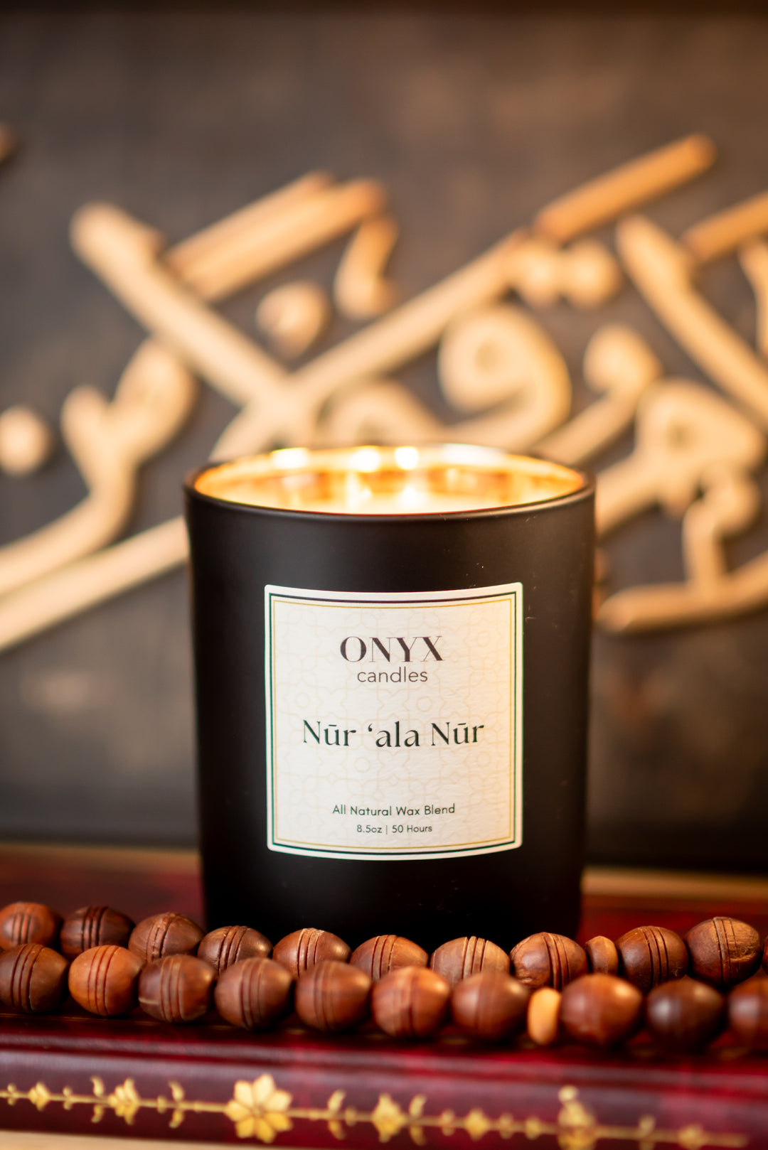 Onyx reed diffuser on Quran with prayer beads